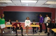 NPHC Executive Board Officers posing in their fraternity and sorority letters.