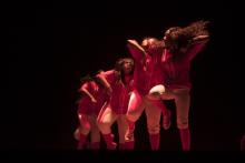 Member of Delta Sigma Theta performing a step routine at a Step Show