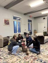 Panhel members petting a dog during one of their study wellness events.