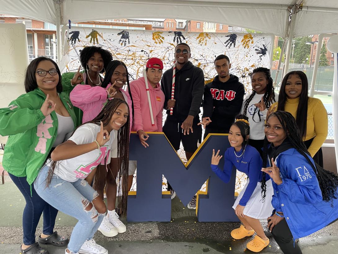 A group of NPHC members around a Block M