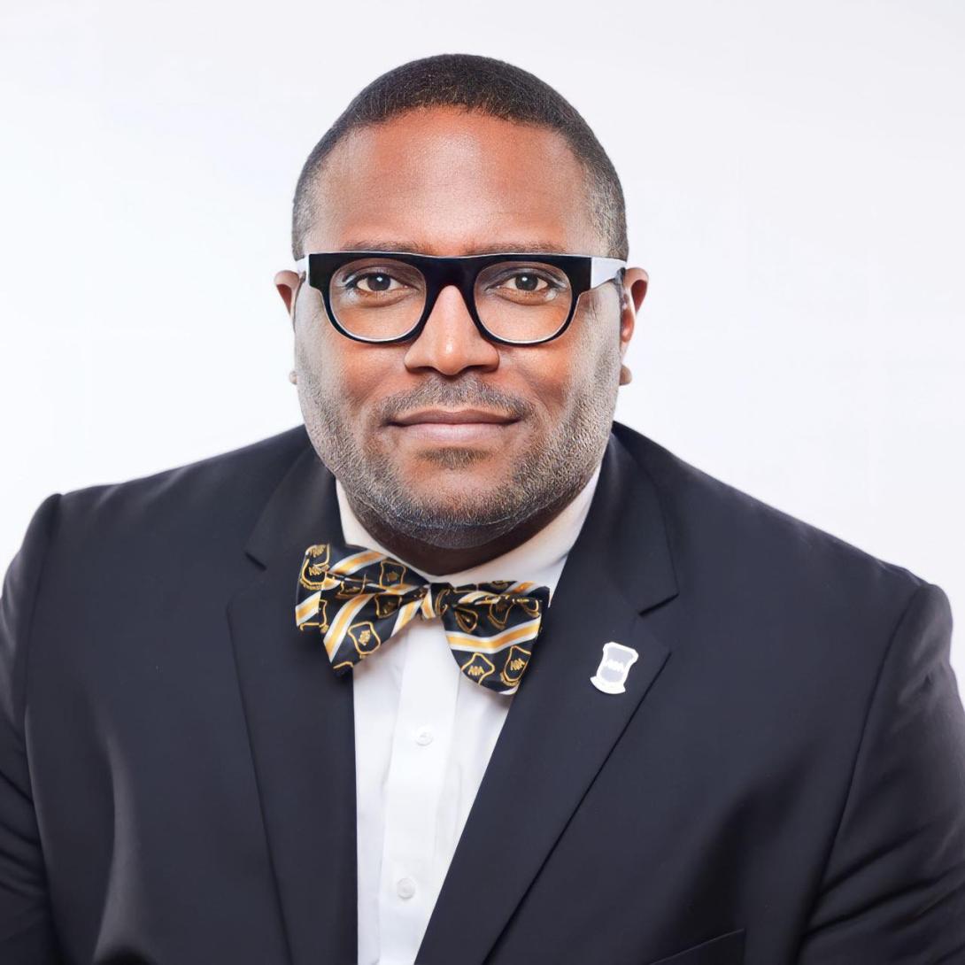 Headshot of Associate Dean and Director of Fraternity and Sorority Life, Travis Martin.